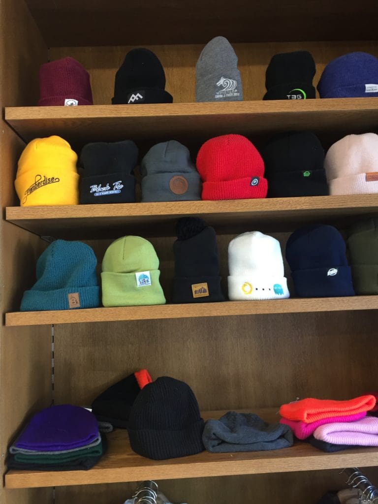 Toques and beanies on display at our Whistler store